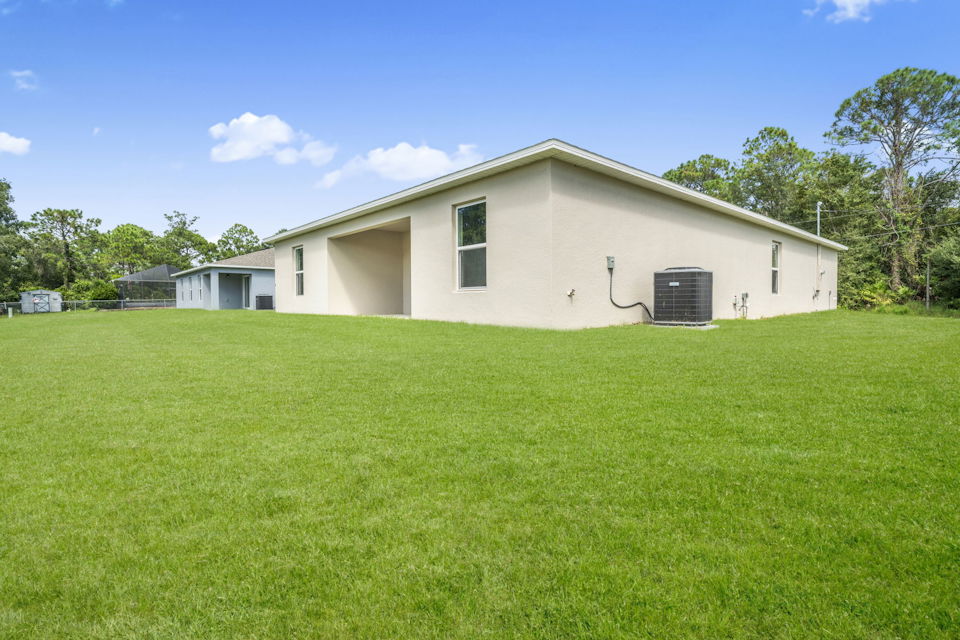 A house with a large lawn.
