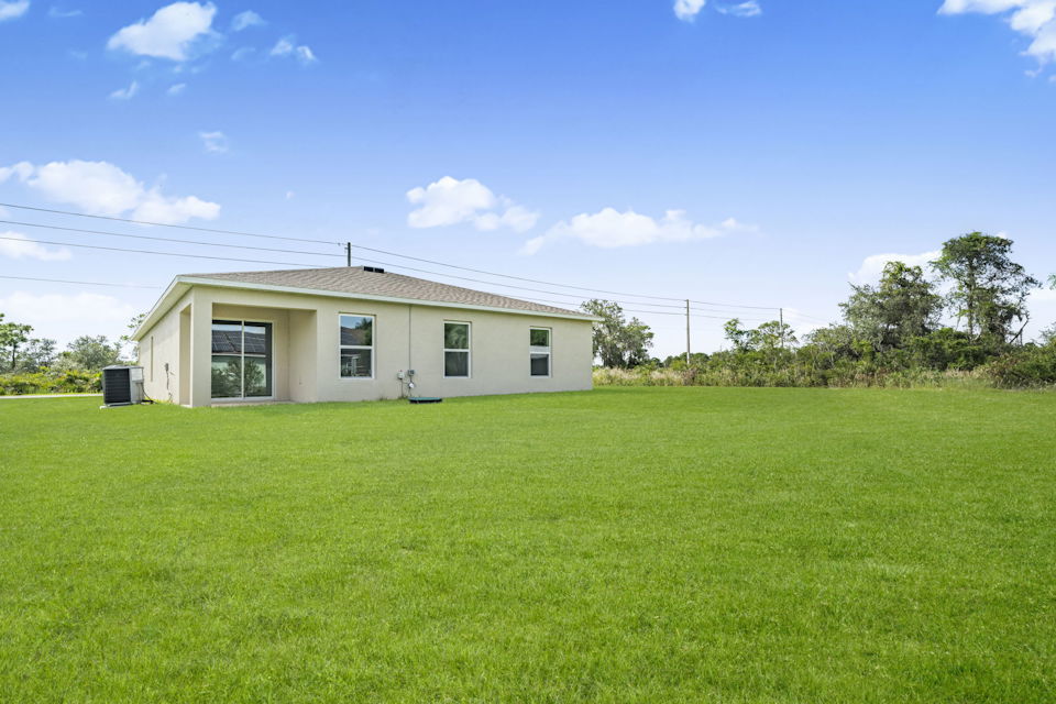A house with a grass yard.