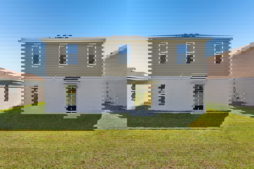 A white house with a garage.