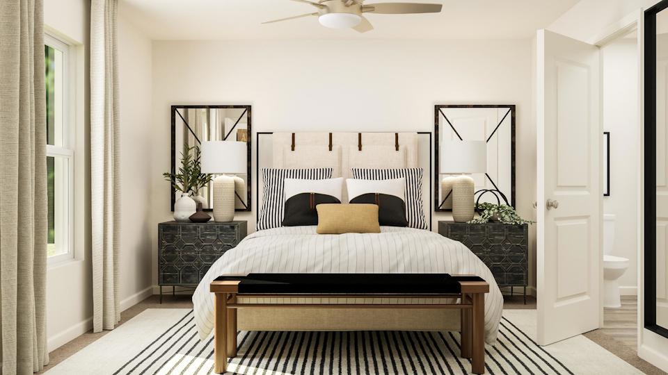 Owner's suite with attached bathroom and walk-in closet.