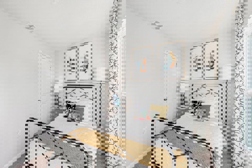 A bed with a black frame.