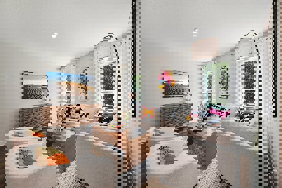 A living room with a couch and a table.