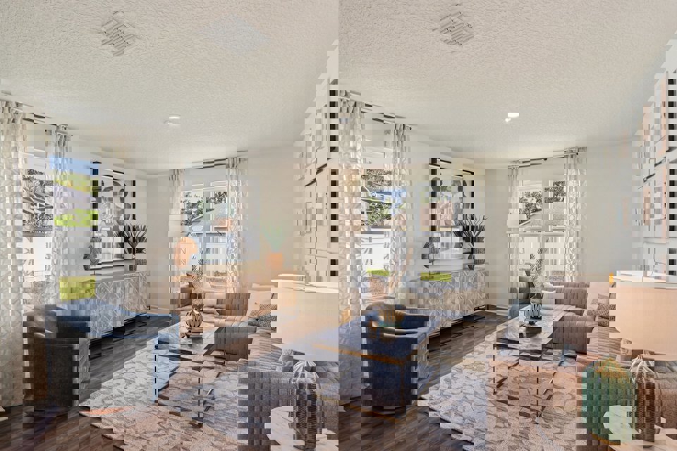 A living room with a couch and a table.