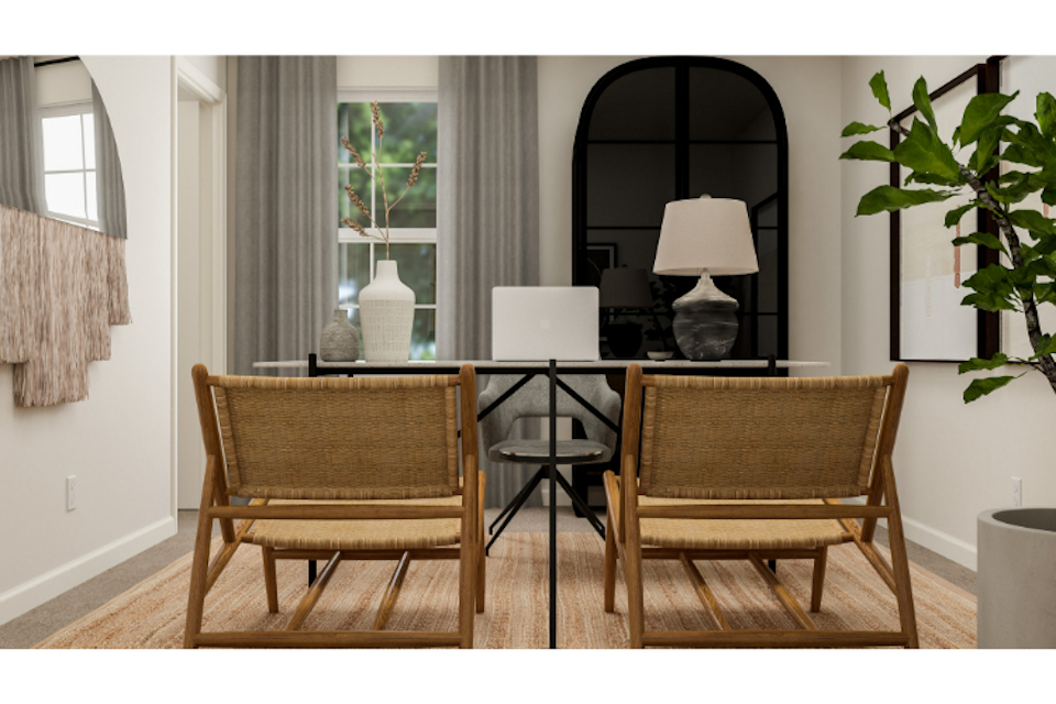 A dining room with a table and chairs.