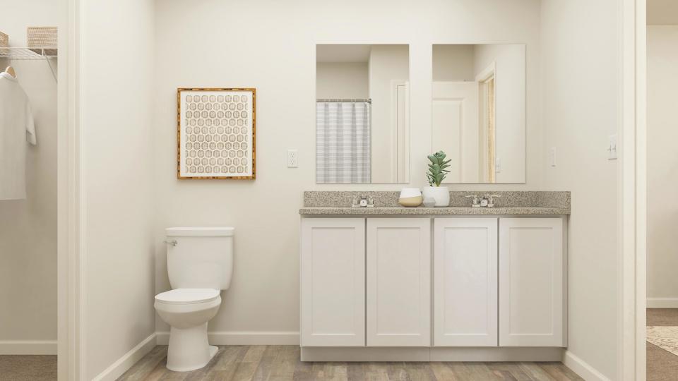 A bathroom with a toilet and sink.