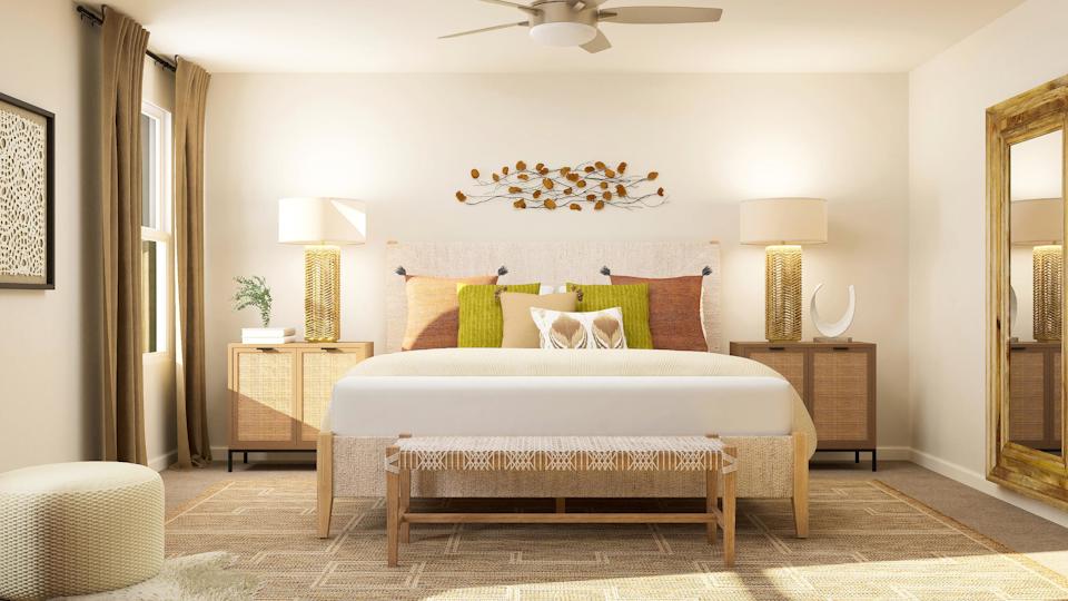 A bedroom with a bed and lamps.