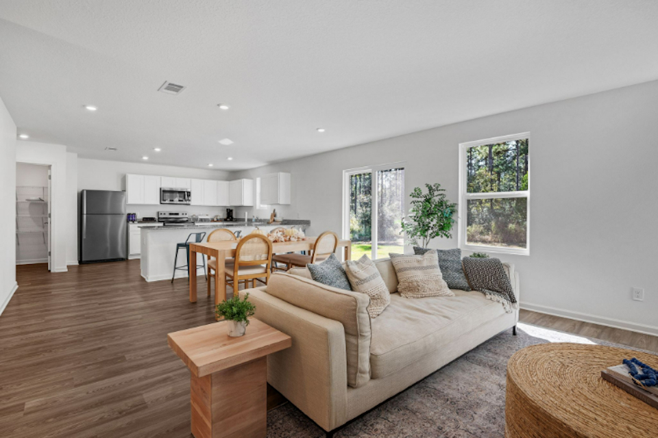 A living room with a couch and a table.