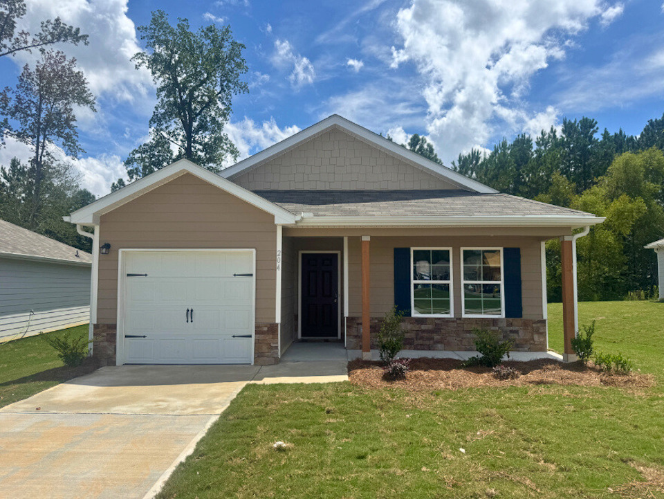 A house with a garage with Little White House in the background.