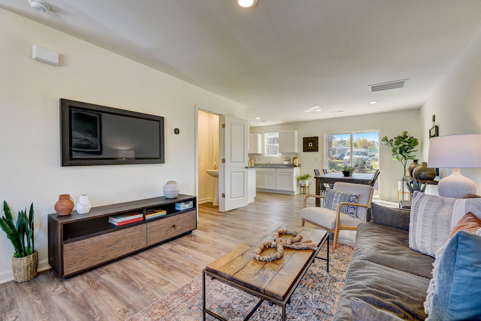 A living room with a tv and couches.