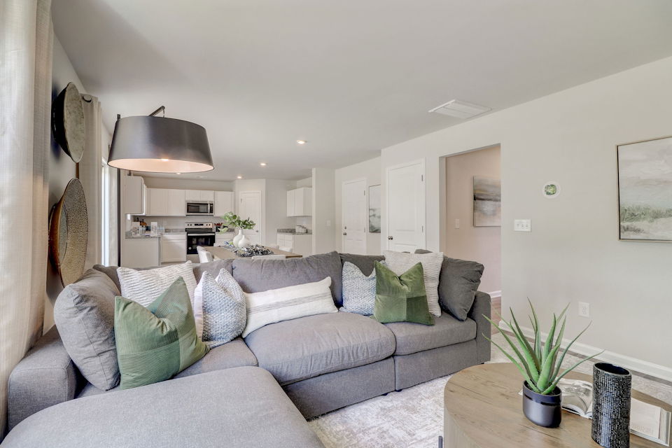 A living room with a couch and a table.