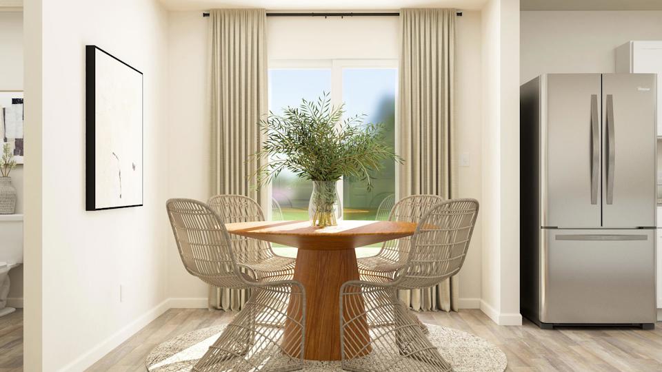 A dining room table with chairs.