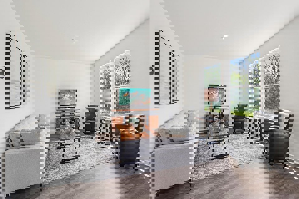 A living room with a couch and a coffee table.