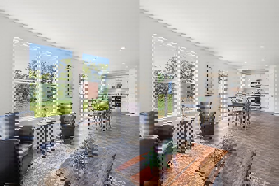 A living room with a wood floor.