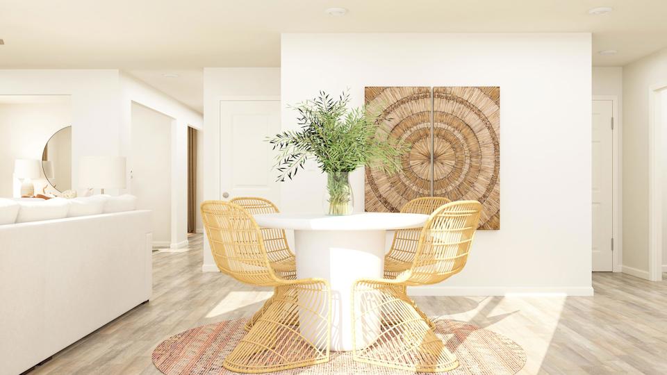 A room with a table and chairs.