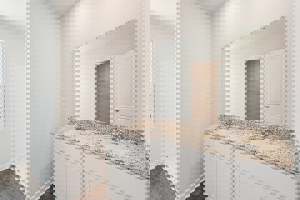 A bathroom with a marble countertop.