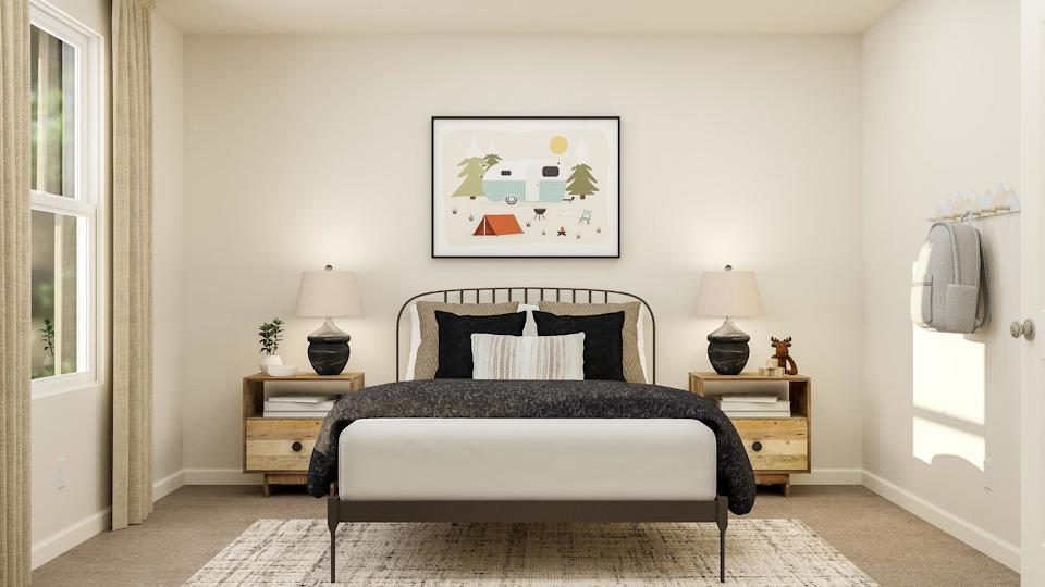 A bedroom with a bed and lamps.