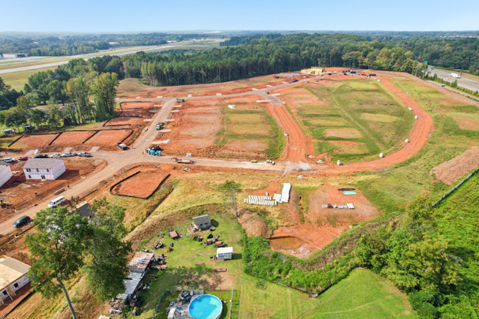 A landscape with trees and buildings.