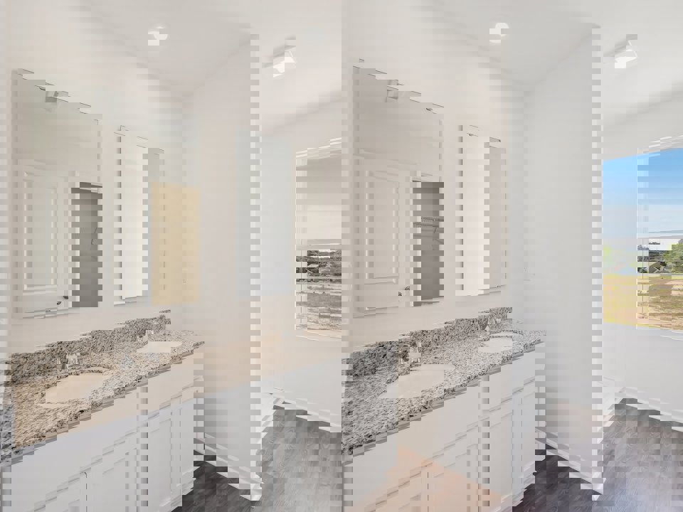 A bathroom with a large mirror.