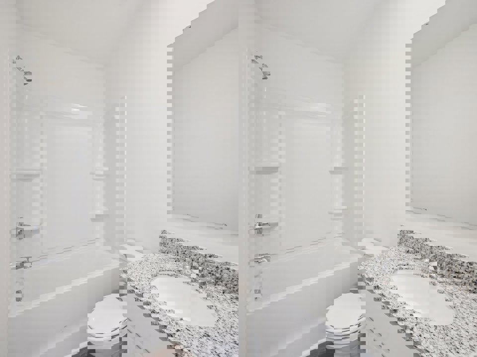 A bathroom with a sink and a toilet.