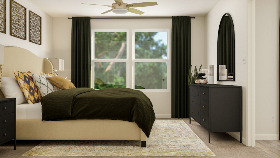 A bedroom with a bed and a window.