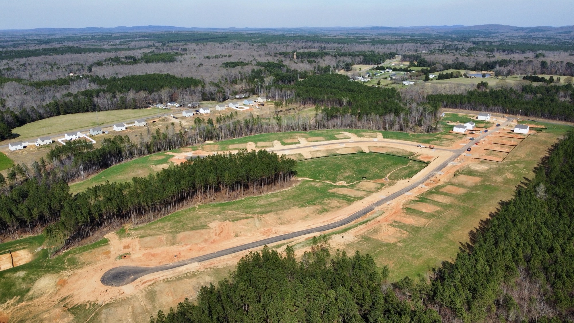 A landscape with trees and buildings.