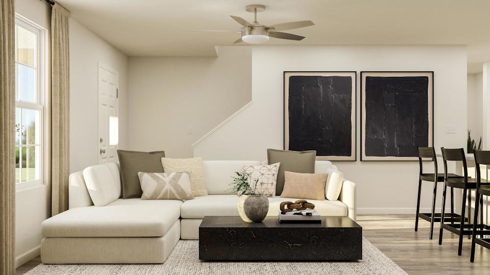 A living room with a couch and a coffee table.
