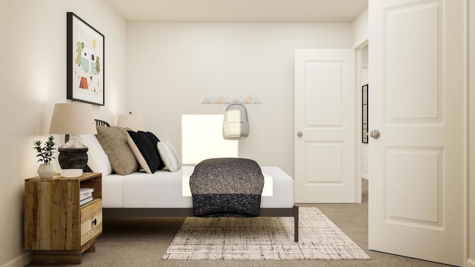 A room with a couch and a chair.