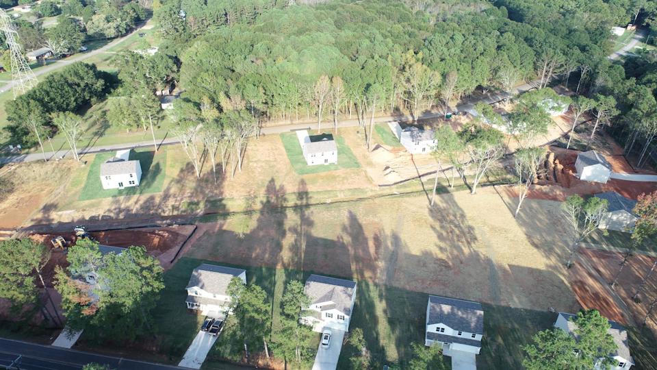 A landscape with trees and buildings.