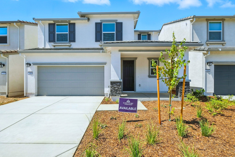 A building with a sign in front.