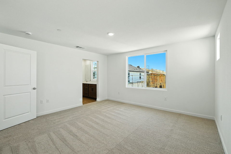 A room with a window and a door.