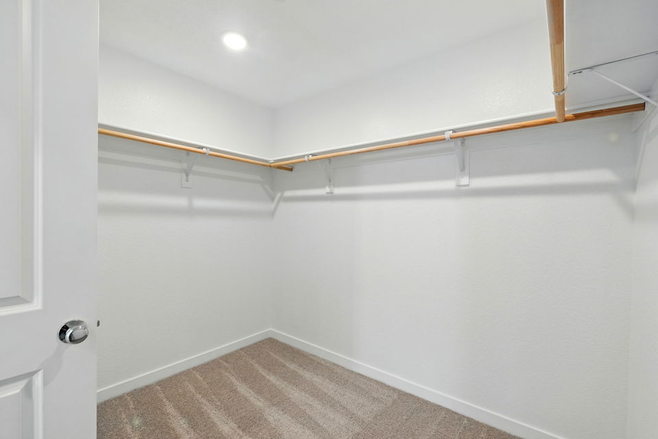 A white room with a wood railing.