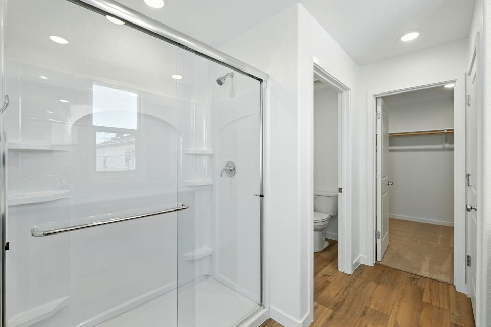 A bathroom with a glass shower.