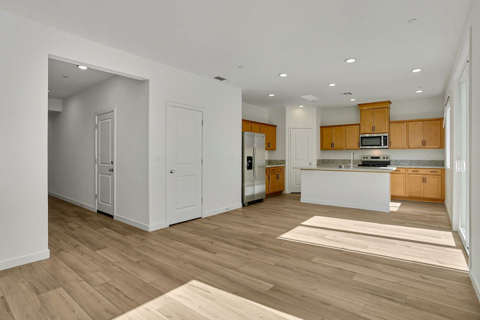 A kitchen with wooden floors.