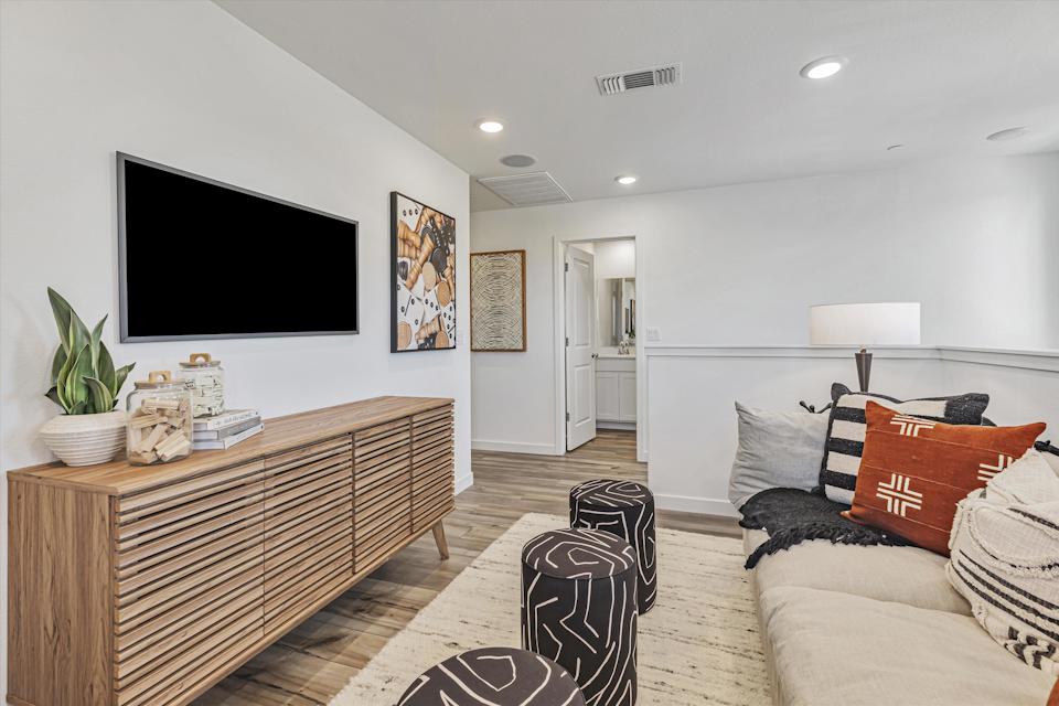 A room with a bed and a tv.