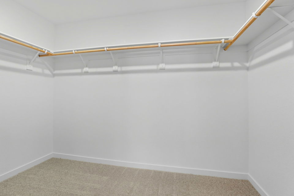 A white wall with a white ceiling.