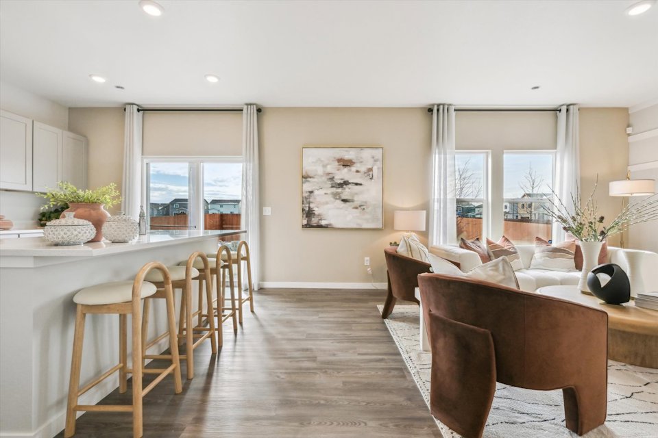 A living room with a large window.